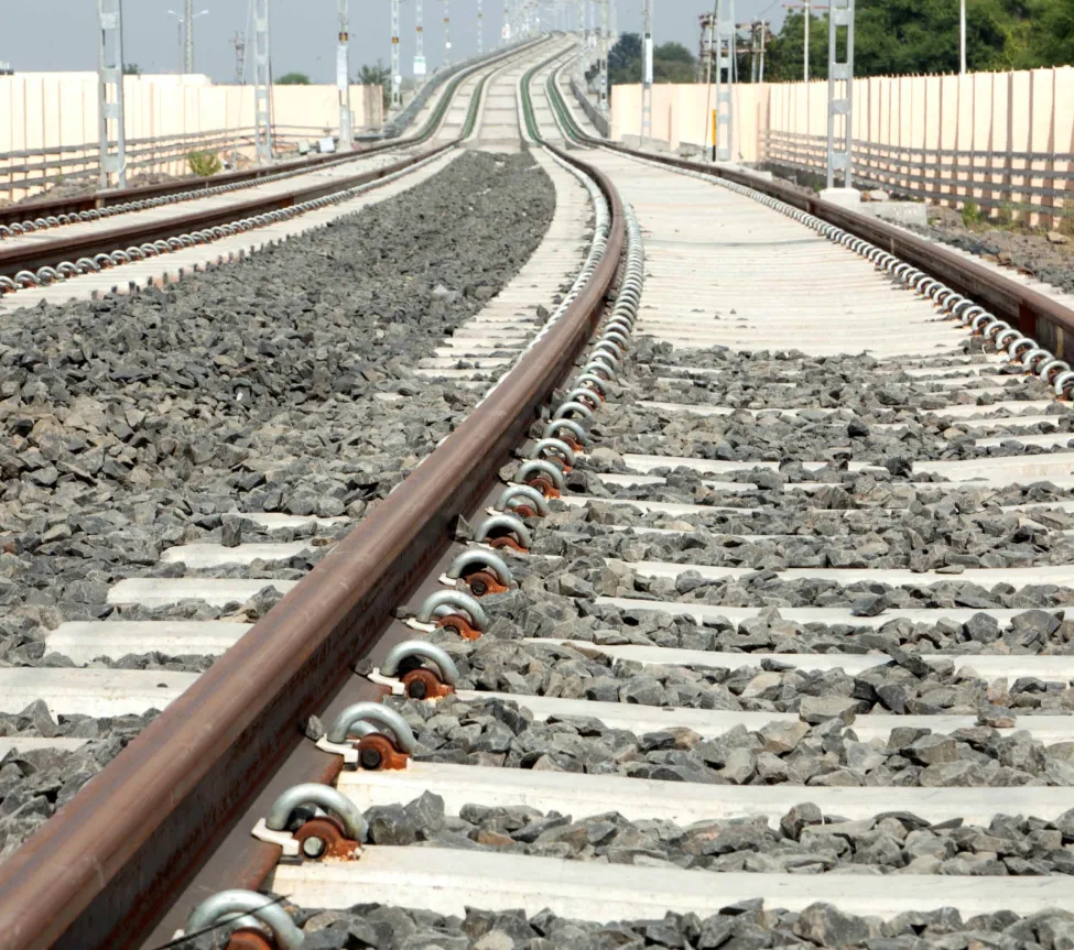 Track fittings and fastenings for railway tracks